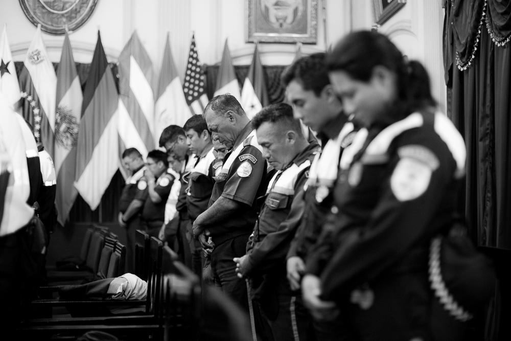 Group of police officers praying 