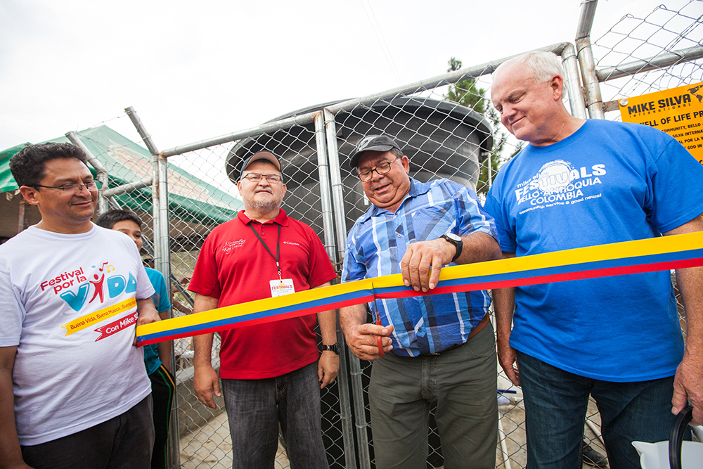  The local Pastor who will manage and watch over the well for the community, cut the ribbon with MSI Board members Pastor Ruben Guajardo (left) and Howard “Butch” Wilson (right).
